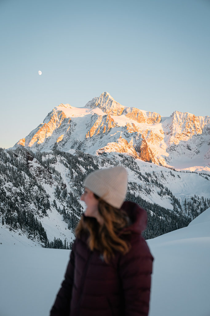 Woman standing in front of Mount Shuksan.